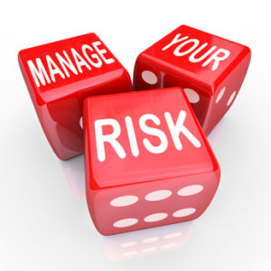 Manage Your Risk in a dangerous world, company, workplace or enterprise by reducing costs and liability, illustrated by these words on three red dice